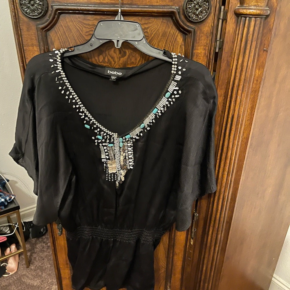 Woman’s Bebe black top satin worn once